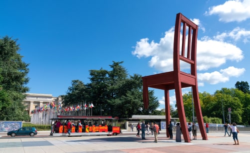 The giant chair with a broken leg stands in front of the Palace of Nations is a symbol of antipersonnel mines. Geneva, Switzerland. 