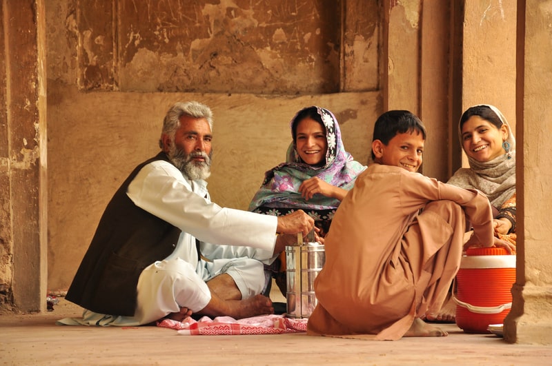 Traditional Pakistani family eating, Balochistan, Pakistan