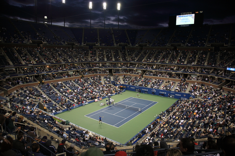 Players in action during US Open tennis tournament. 