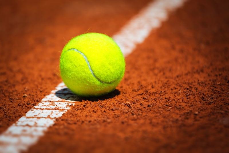 Tennis Ball on a clay court. facts about tennis