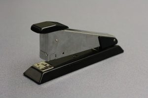 A spring loaded stapler.