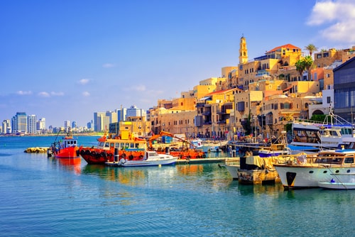 Old town and port of Jaffa and modern skyline of Tel Aviv city, Israel.