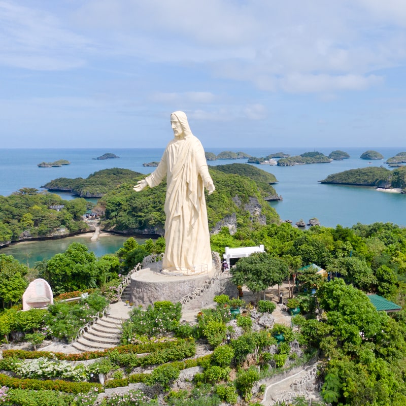 Statue of Jesus Christ on Pilgrimage island in Hundred Islands National Park, Pangasinan, Philippines. 