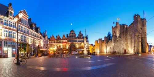 Panoramic view of Sint-Veerleplein, St Veerle's Square, and Gravensteen at night, Ghent, Belgium.
