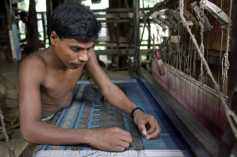 a loom in a weaving factory in the village Tangail, Bangladesh.
