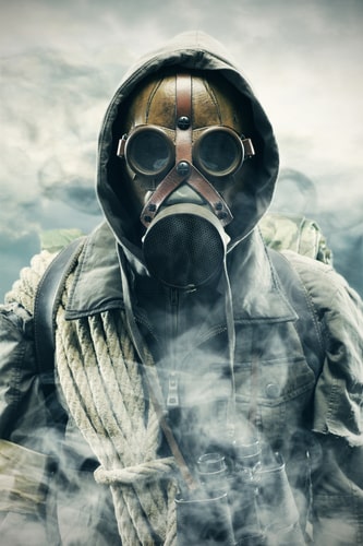 Environmental disaster. Post apocalyptic survivor in gas mask.
