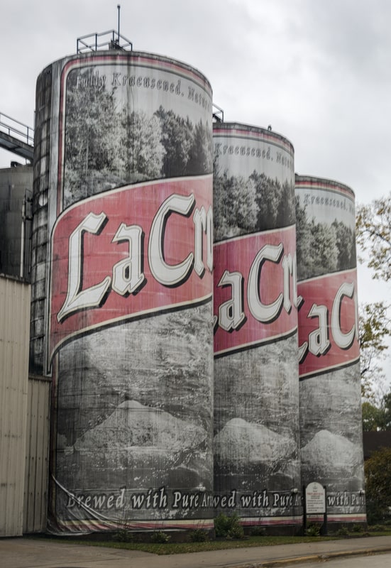 La Crosse Lager storage tanks shaped like a 6 pack of beer cans