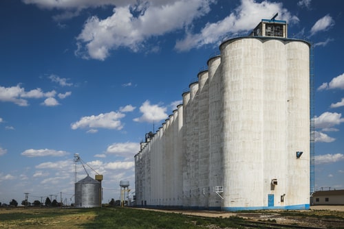 A large grain silo in a rural town. facts about Kansas. 