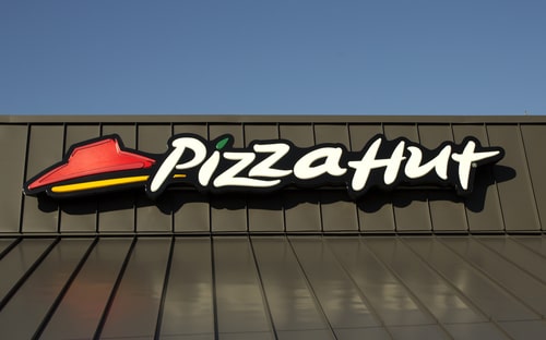 The Pizza Hut logo on a metal roof. 