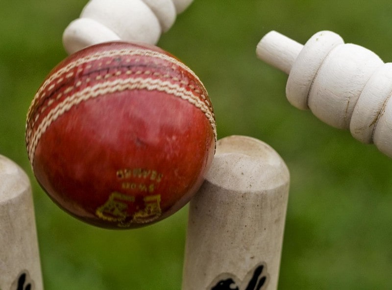 Cricket ball hits the stumps.