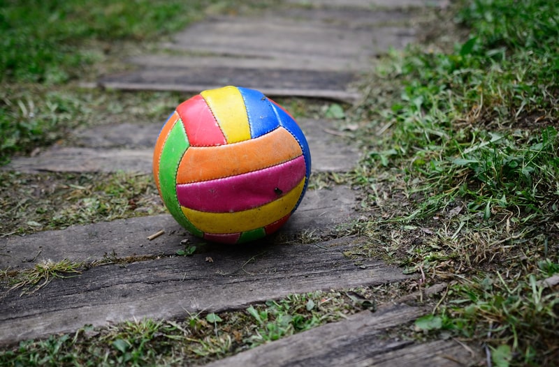 Old worn volleyball on ground. facts about Volleyball