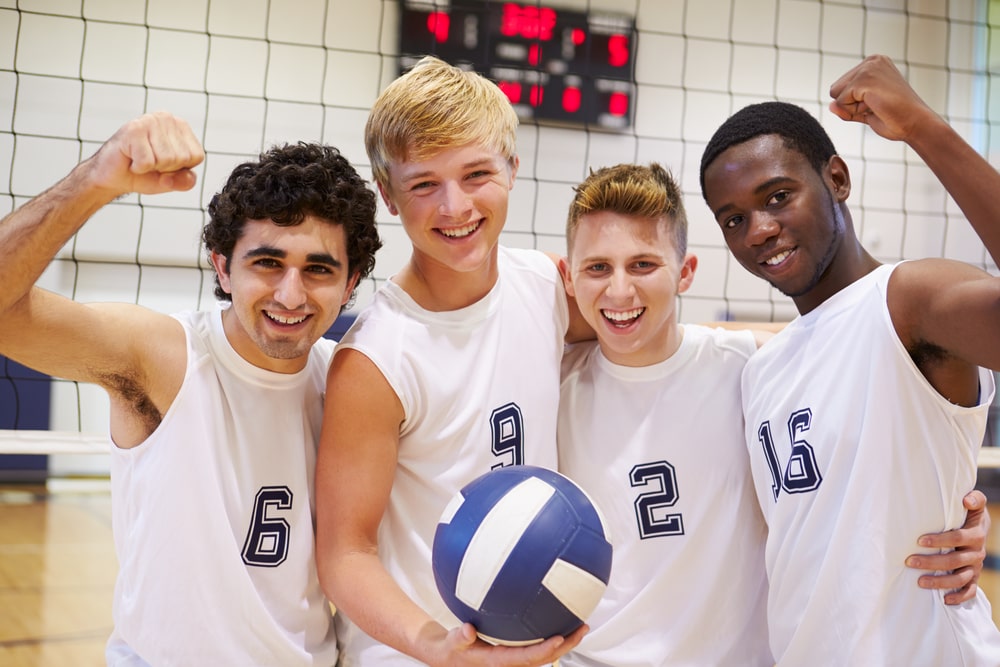 high school friends on a volleyball court. interesting facts about volleyball