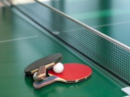 table tennis racket and ball on a table. Table tennis interesting facts