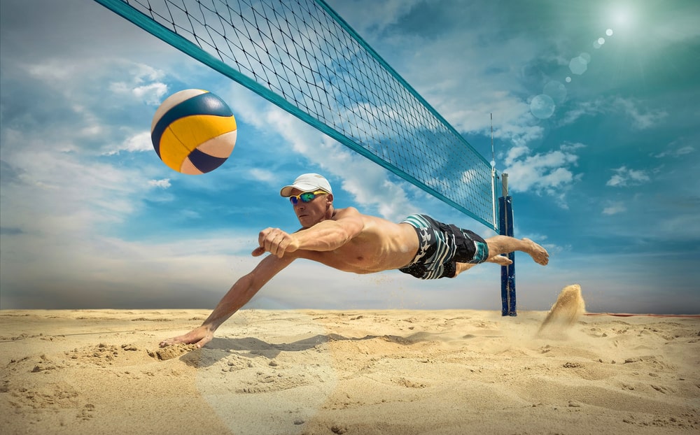 a man playing beach volleyball. Volleyball fact file