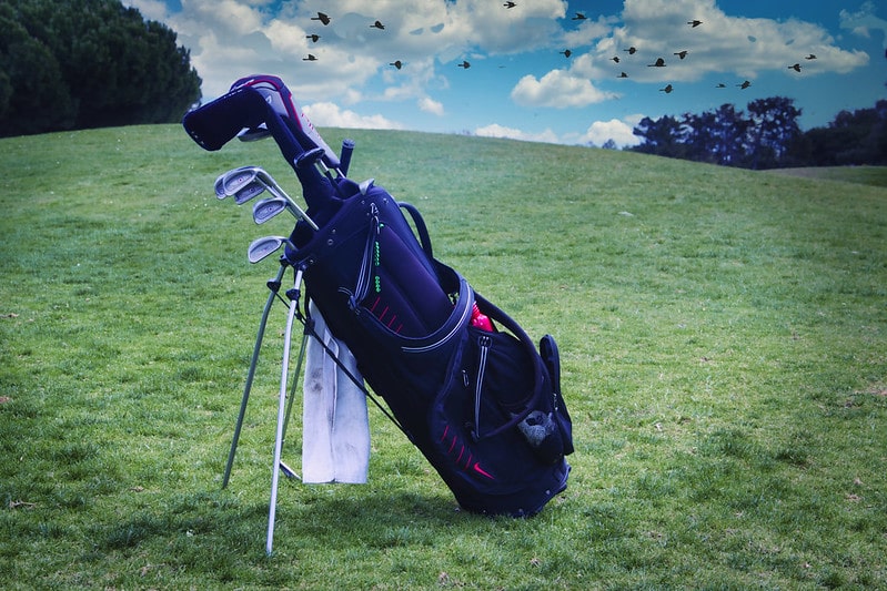 a golf bag with golf clubs. facts about golf