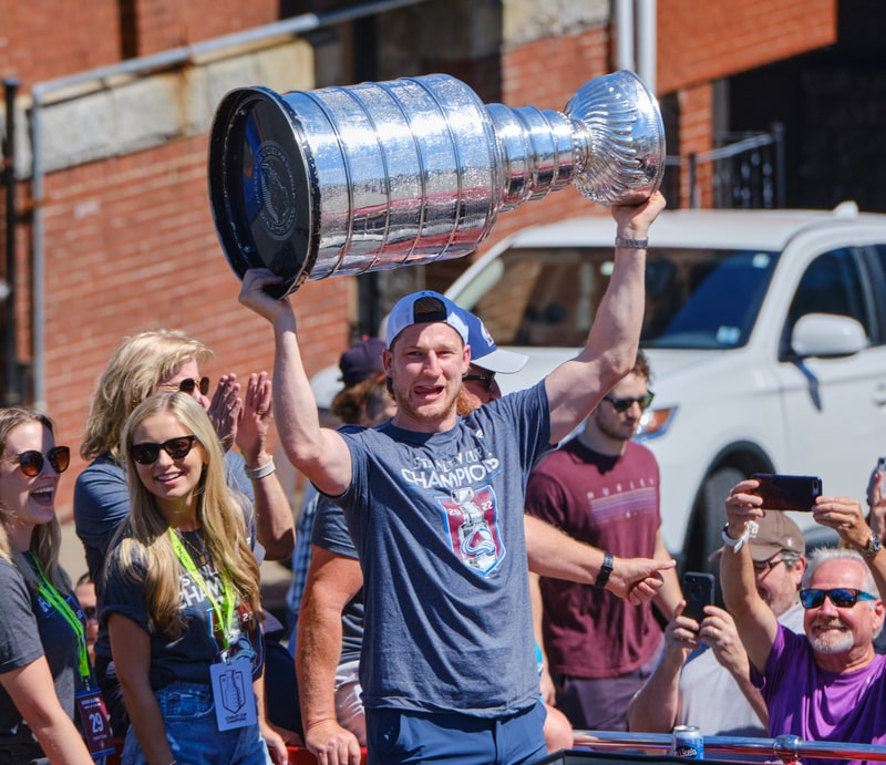 Nathan MacKinnon of the Stanley Cup Winning Colorado Avalanche brings the cup for a Parade