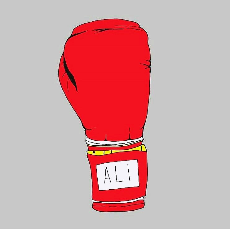 A boxing glove with Ali written