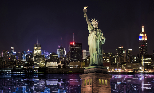 Manhattan Skyline and The Statue of Liberty at Night, New York City.