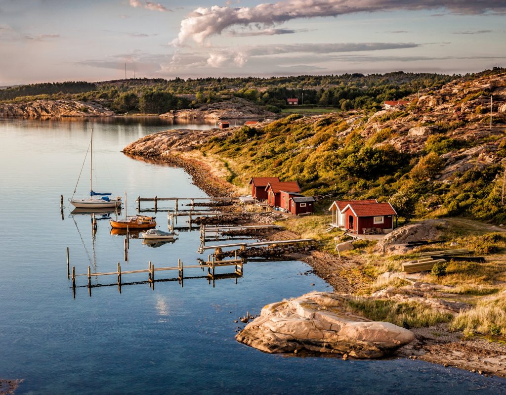A leisurely harbour on the west coast of Sweden where small family boats rest by the boat houses. Sweden fact file
