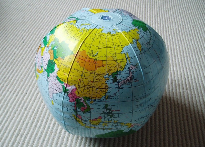 An inflatable globe. maps facts