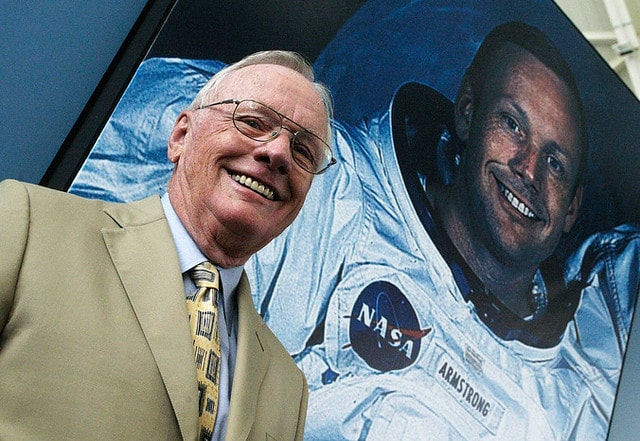 Neil Armstrong poses on the background of his picture during a visit to Spain in 2005.