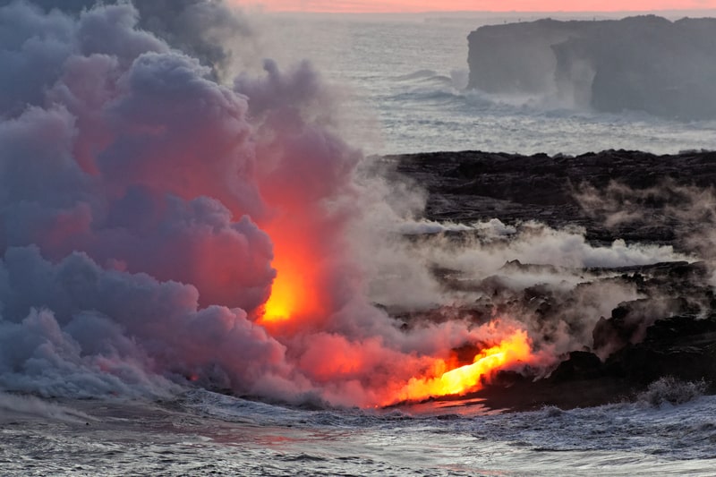Lava flowing into ocean - Kilauea Volcano, Big Island, Hawaii.