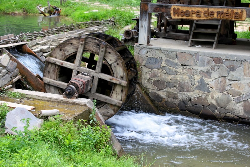 Water mill extracting the power of flowing water. Facts about hydroelectric power
